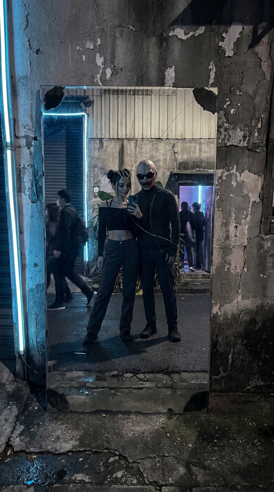 Two characters take a mirror selfie inside the venue.